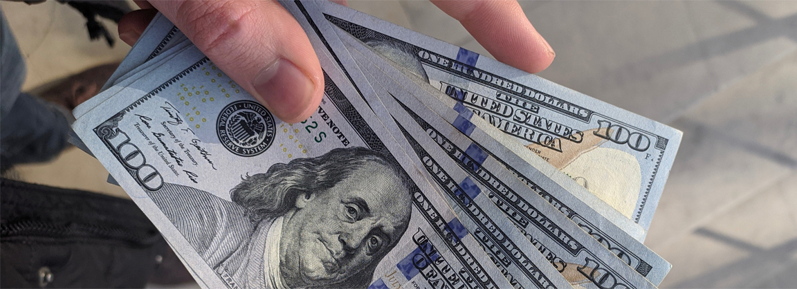 handful of money Photo by Frederick Warren on Unsplash